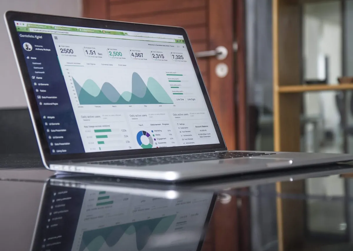 Small business owner researching website costs on a laptop — how much does a website cost in the UK